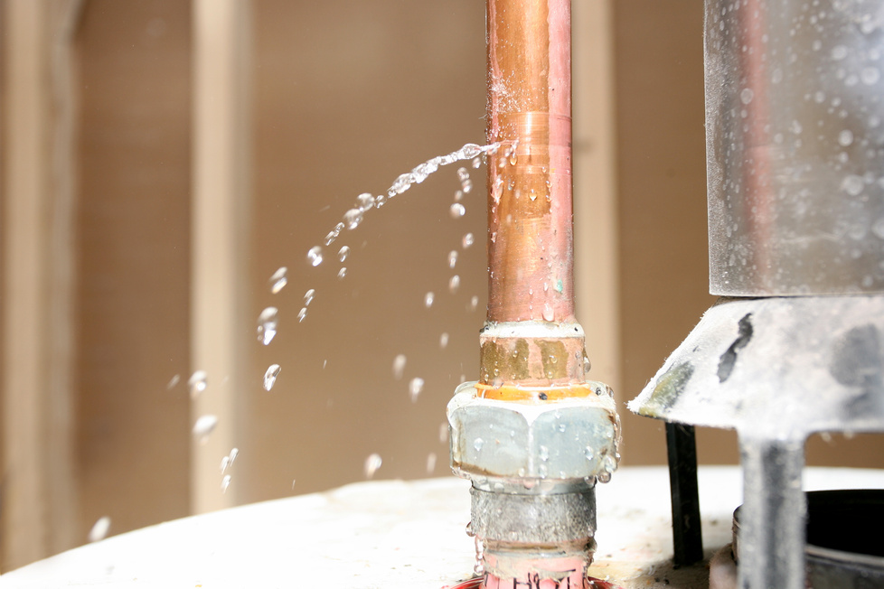 Close-up of drain pipe leaking water